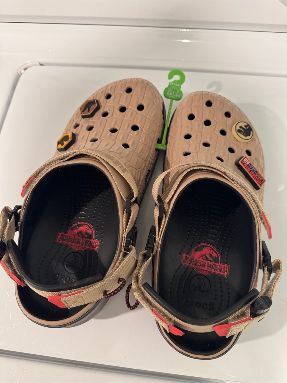 CROCS Tan Jurassic World Clogs with Red and Black Accents
